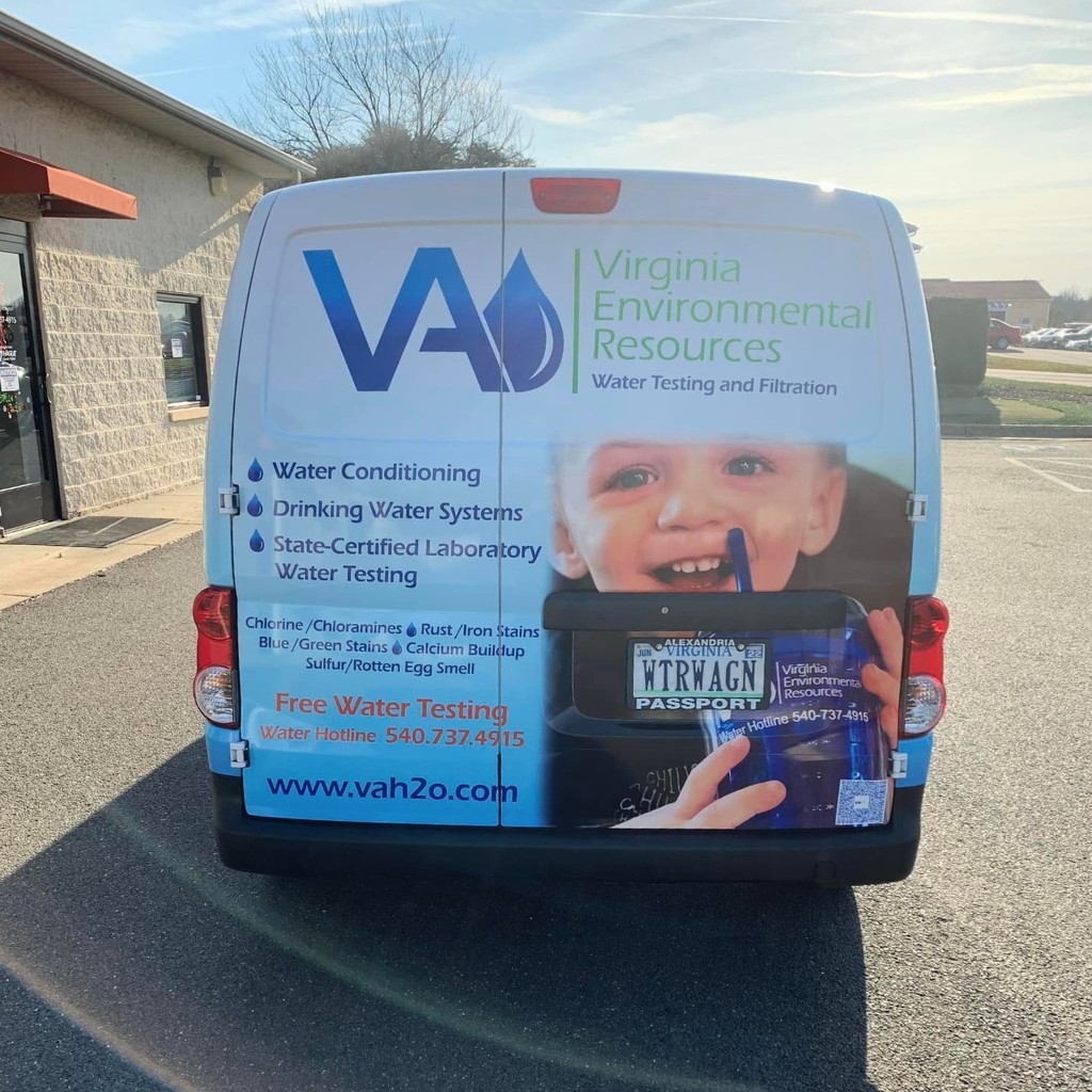 A virginia environmental resources water treatment services work van with a picture of a child